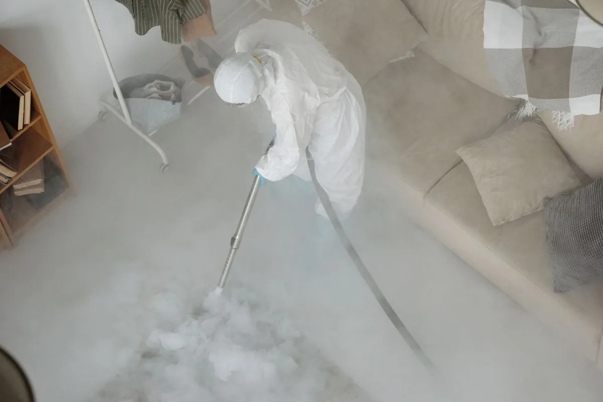 Biohazard cleanup technician in protective equipment, Longview, WA